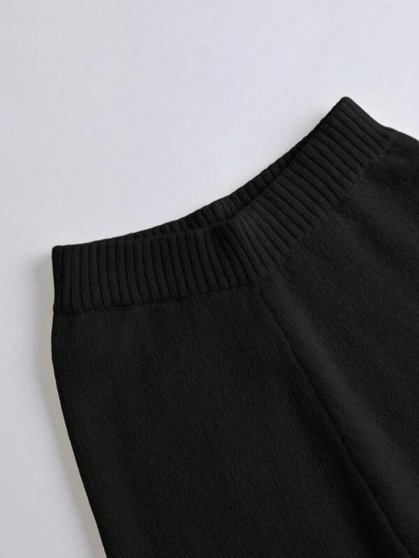 Conjunto Tricô Transpassado Com Calça Flare E Cinto Decorativo