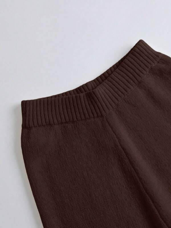 Conjunto Tricô Transpassado Com Calça Flare E Cinto Decorativo